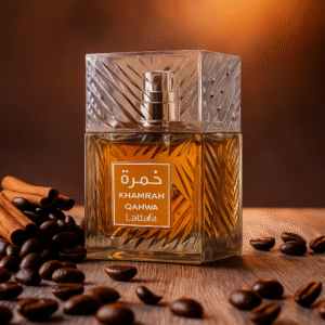 Lattafa Khamrah Qahwa perfume bottle with amber liquid on a warm background, coffee beans and cinnamon on the table.