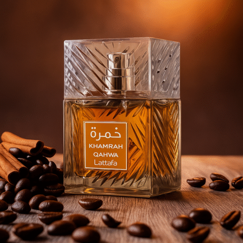 Lattafa Khamrah Qahwa perfume bottle with amber liquid on a warm background, coffee beans and cinnamon on the table.